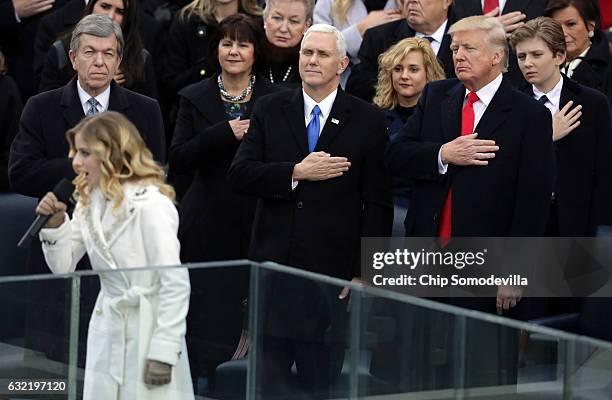 Jackie Evancho performs the National Anthem as Vice President Mike Pence and President Donald Trump watch on the West Front of the U.S. Capitol on...