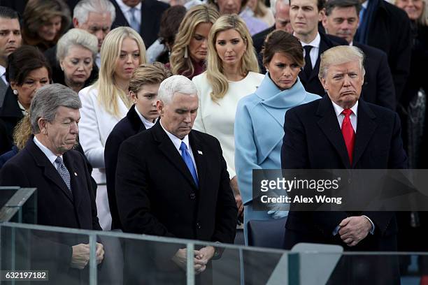 President Donald Trump and Vice President Mike Pence stand on the West Front of the U.S. Capitol on January 20, 2017 in Washington, DC. In today's...