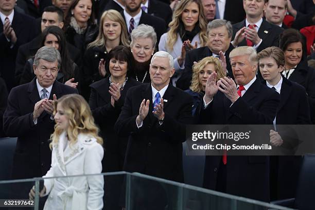 Jackie Evancho performs the National Anthem as Vice President Mike Pence and President Donald Trump clap on the West Front of the U.S. Capitol on...