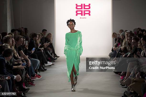 Model runs the runway at the Riani show during the Mercedes-Benz Fashion Week Berlin A/W 2017 at Kaufhaus Jandorf in Berlin, Germany on January 17,...