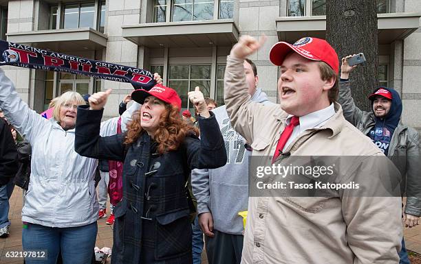 Protesters against and supporters of Donald Trump gather prior to the presidential inauguration in front of the Trump Hotel on January 20, 2017 in...