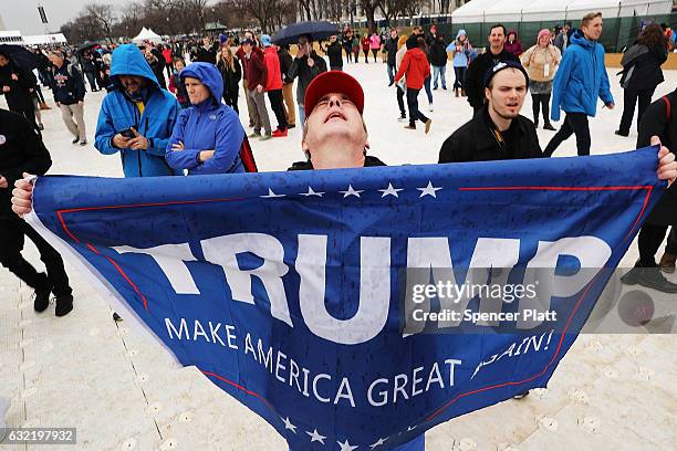 President Donald Trump supporter reacts on the National Mall to the inauguration of US President Donald Trump on January 20, 2017 in Washington, DC....