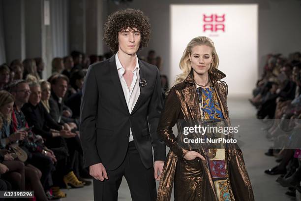 Model and Larissa Marolt run the runway at the Riani show during the Mercedes-Benz Fashion Week Berlin A/W 2017 at Kaufhaus Jandorf in Berlin,...