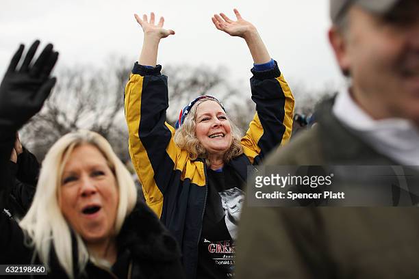 President Donald Trump supporters react on the National Mall to the inauguration of Donald Trump on January 20, 2017 in Washington, DC. Washington...