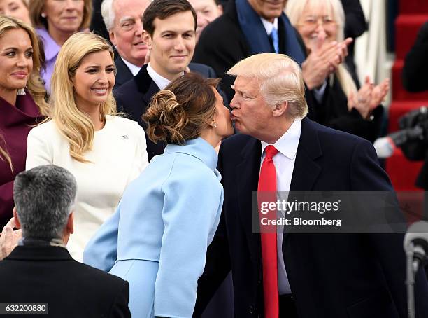 President Donald Trump, kisses U.S. First Lady Melania Trump on the cheek during the 58th presidential inauguration in Washington, D.C., U.S., on...