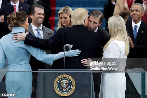 President Donald Trump kisses his son Eric Trump after his inauguration on the West Front of the U.S. Capitol on January 20, 2017 in Washington, DC....