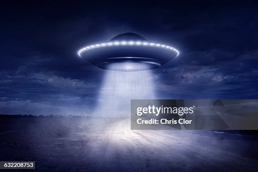Alien spaceship landing on rural road Alien spaceship landing on rural road