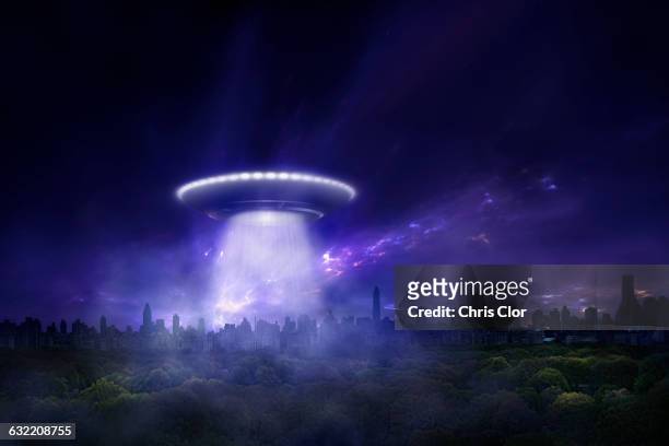 alien spaceship landing in urban park - city night stock illustrations