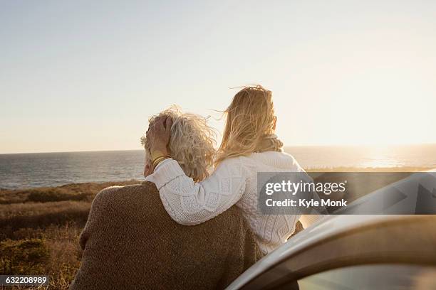 older caucasian couple looking at ocean view - car back view bildbanksfoton och bilder