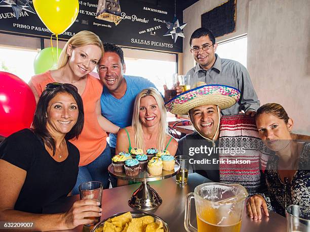 friends celebrating birthday in cafe - sombrero stock pictures, royalty-free photos & images