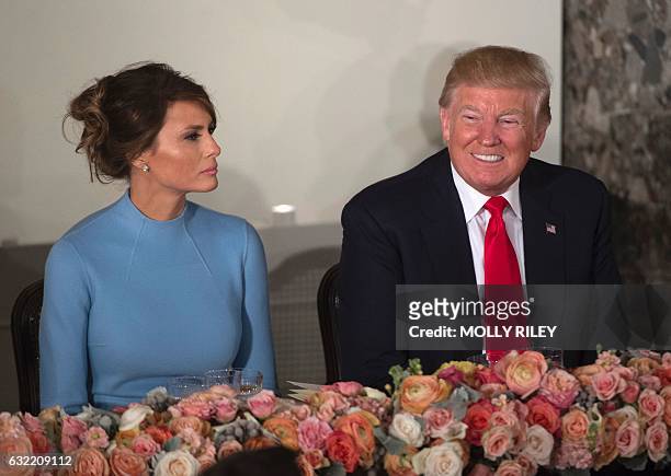 President Donald Trump and First Lady Melania Trump attend the Inaugural Luncheon at the US Capitol following Donald Trump's inauguration as the 45th...