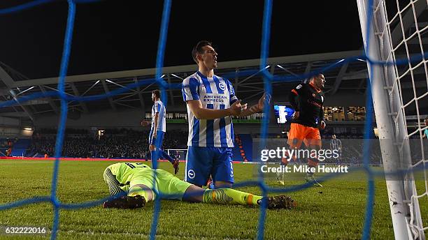Lewis Dunk of Brighton reacts after deflecting the ball past goalkeeper David Stockdale for an own goal during the Sky Bet Championship match between...