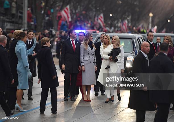 The family of US President Donald Trump arrives at the reviewing stand at the White House in Washington, DC, on January 20, 2017 following...