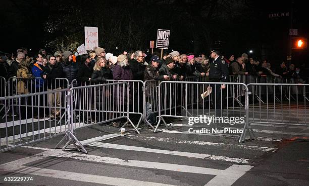 Activists attend the 'We Stand United' rally on the eve of US President-elect Donald rump's inauguration outside Trump International Hotel and Tower...