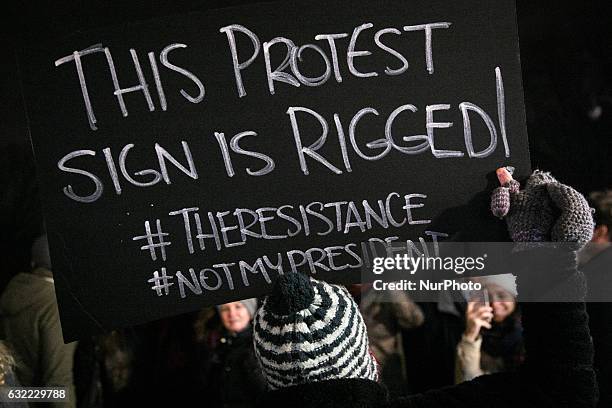 Activists attend the 'We Stand United' rally on the eve of US President-elect Donald rump's inauguration outside Trump International Hotel and Tower...