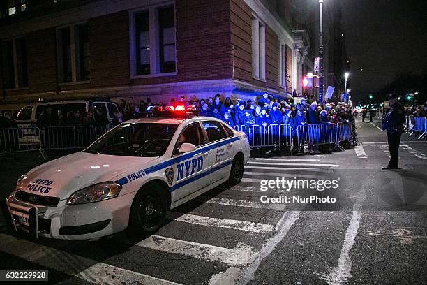 Activists attend the 'We Stand United' rally on the eve of US President-elect Donald rump's inauguration outside Trump International Hotel and Tower...