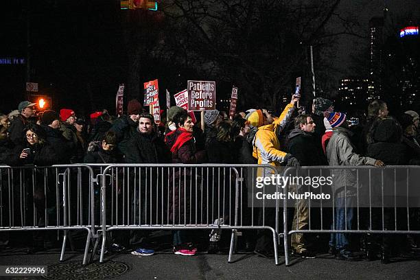 Activists attend the 'We Stand United' rally on the eve of US President-elect Donald rump's inauguration outside Trump International Hotel and Tower...