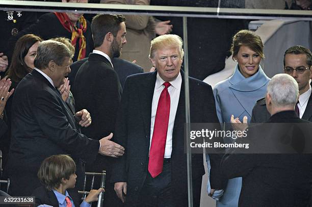 President Donald Trump arrives in the presidential review stand outside the White House during the 58th presidential inauguration parade in...