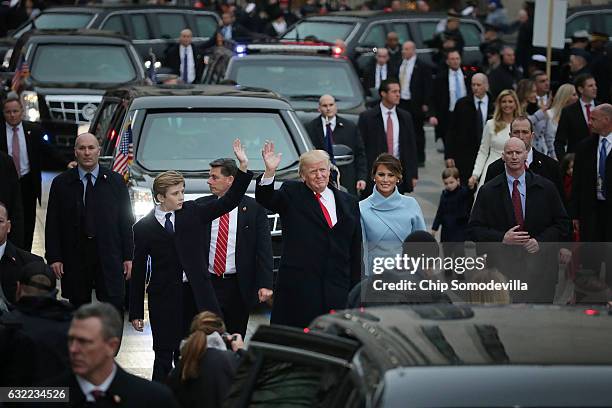 President Donald J. Trump , first lady Melania Trump and their son Barron Trump walk down Pennsylvania Avenue in front of the White House during the...