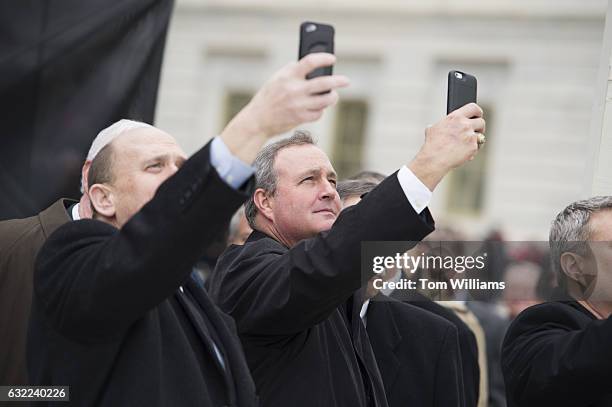 Reps. Tom Reed, R-N.Y., left, and Jeff Duncan, R-S.C., take pictures on Inauguration Day before Donald J. Trump was sworn in as the 45th President of...