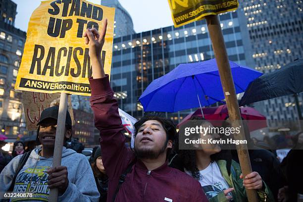 Activists participate in the Stand Against Trump march at Foley Square on January 20, 2017 in New York City. During the rally, protestors marched...