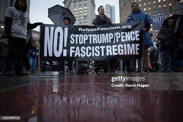 Activists participate in the Stand Against Trump march at Foley Square on January 20, 2017 in New York City. During the rally, protestors marched...