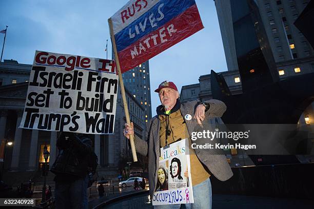 Activists participate in the Stand Against Trump march at Foley Square on January 20, 2017 in New York City. During the rally, protestors marched...