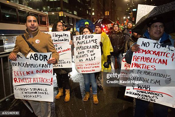 Activists march down Broadway during the Stand Against Trump rally on January 20, 2017 in New York City. During the rally, protestors marched from...