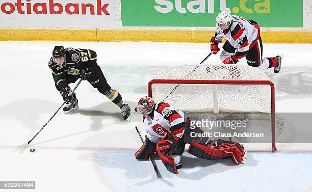 Mitchell Stephens of the London Knights looks to get a shot at Olivier Lafreniere of the Ottawa 67's during an OHL game at Budweiser Gardens on...