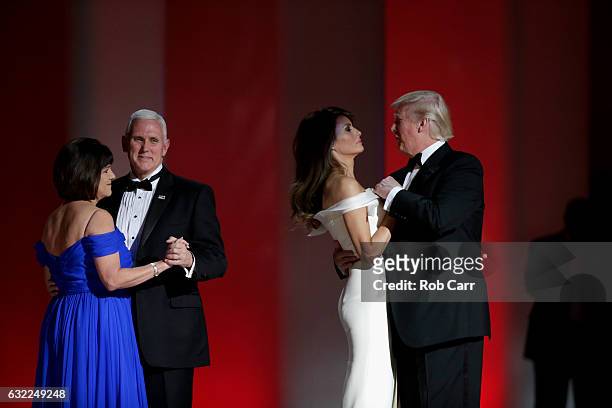 Vice President Mike Pence and President Donald Trump dance with their wives at the Liberty Inaugural Ball on January 20, 2017 in Washington, DC. The...