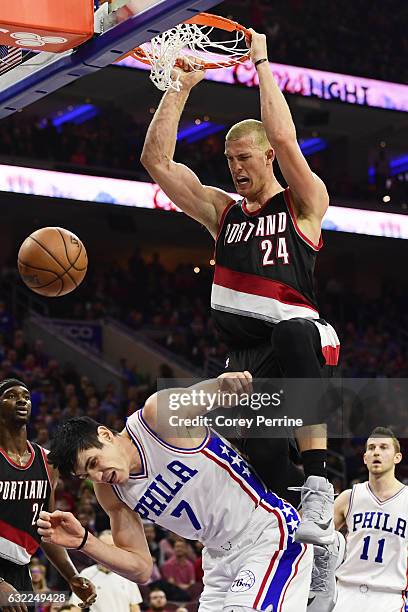 Mason Plumlee of the Portland Trail Blazers dunks on Ersan Ilyasova of the Philadelphia 76ers during the third quarter at the Wells Fargo Center on...