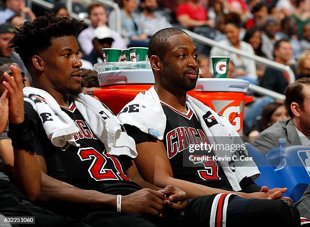 Jimmy Butler and Dwyane Wade of the Chicago Bulls look on from the bench during the game against the Atlanta Hawks at Philips Arena on January 20,...