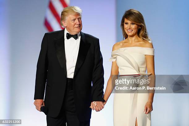 President Donald Trump and first lady Melania Trump arrive at the Freedom Inaugural Ball at the Washington Convention Center January 20, 2017 in...