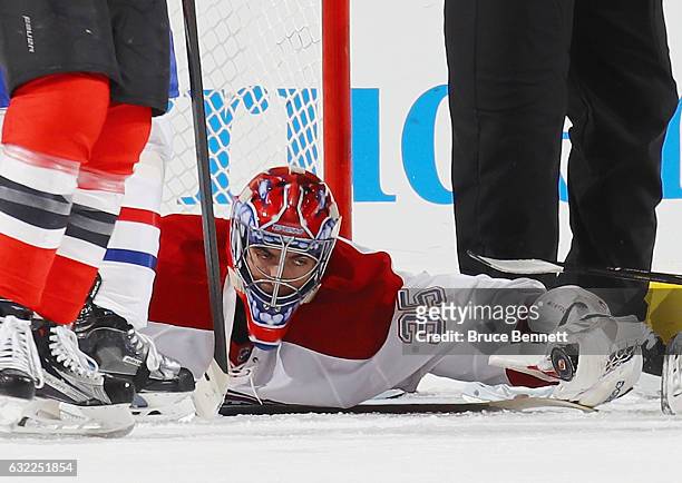 Al Montoya of the Montreal Canadiens grabs the puck late in the third period against the New Jersey Devils at the Prudential Center on January 20,...