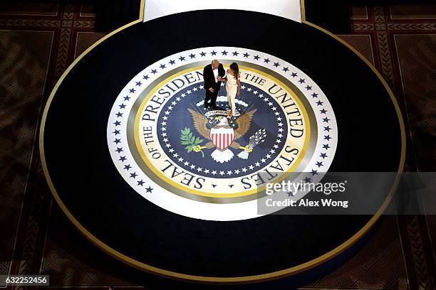 President Donald Trump and his wife First Lady Melania Trump prepare to dance during A Salute To Our Armed Services Inaugural Ball at the National...