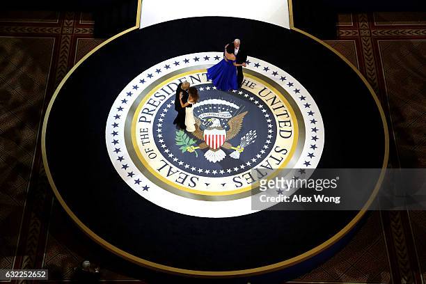 President Donald Trump, his wife First Lady Melania Trump, Vice President Mike Pence and Karen Pence dance during A Salute To Our Armed Services...