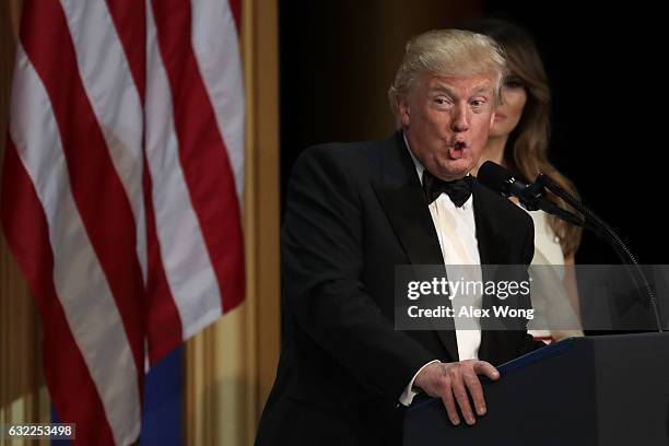 President Donald Trump speaks as his wife First Lady Melania Trump looks on during A Salute To Our Armed Services Inaugural Ball at the National...