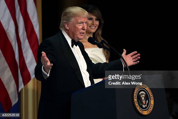 President Donald Trump speaks as his wife First Lady Melania Trump looks on during A Salute To Our Armed Services Inaugural Ball at the National...