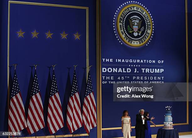 President Donald Trump, his wife First Lady Melania Trump, Vice President Mike Pence and Karen Pence stand on stage during A Salute To Our Armed...