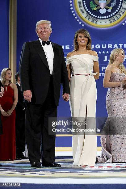 President Donald Trump and first lady Melania Trump thank guests during the inaugural Armed Forces Ball at the National Building Museum January 20,...