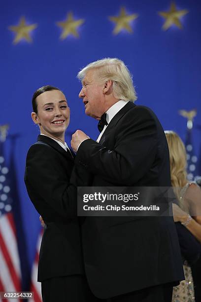 President Donald Trump dances with a member of the U.S. Armed forces during the inaugural Armed Forces Ball at the National Building Museum January...