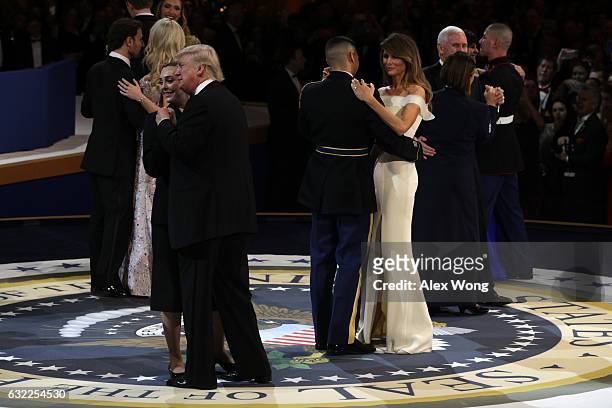 President Donald Trump and his wife First Lady Melania Trump dance with members of the military during A Salute To Our Armed Services Inaugural Ball...