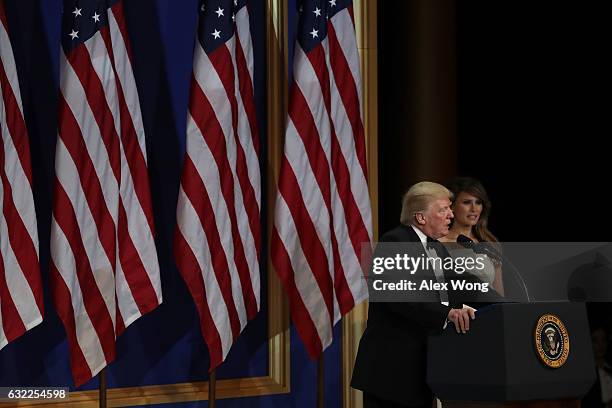 President Donald Trump speaks as his wife First Lady Melania Trump looks on during A Salute To Our Armed Services Inaugural Ball at the National...