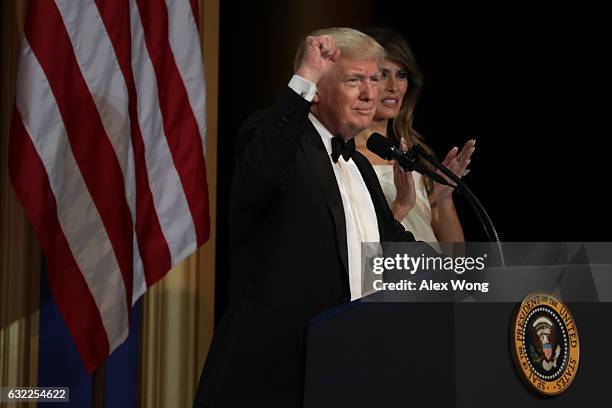 President Donald Trump speaks as his wife First Lady Melania Trump looks on during A Salute To Our Armed Services Inaugural Ball at the National...