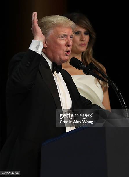 President Donald Trump speaks as his wife First Lady Melania Trump looks on during A Salute To Our Armed Services Inaugural Ball at the National...