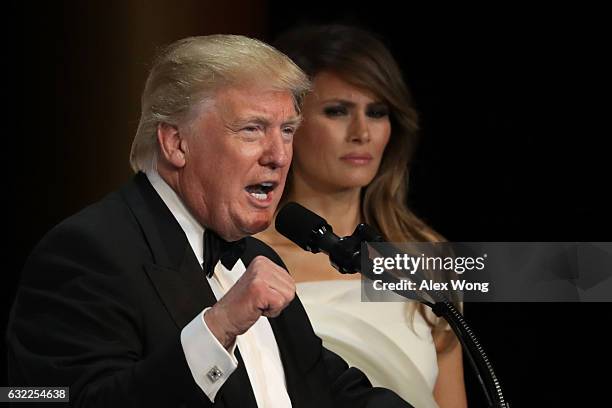 President Donald Trump speaks as his wife First Lady Melania Trump looks on during A Salute To Our Armed Services Inaugural Ball at the National...