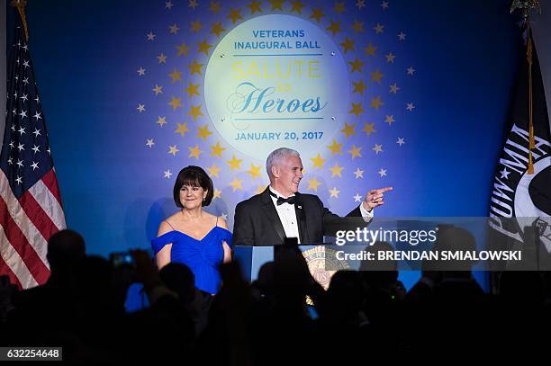 Karen Pence listens to her husband US Vice President Mike Pence as he speaks to members of the American Legion at their Veterans Ball January 20,...