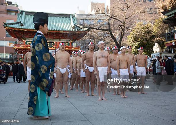 Participants pray prior to the start of the ice water winter purification ceremony on January 21, 2017 in Tokyo, Japan. At Daikoku Matsuri festival,...