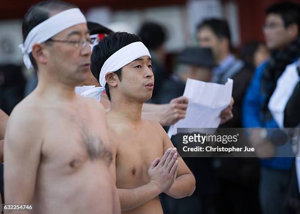 Participant meditates prior to the start of the ice water winter purification ceremony on January 21, 2017 in Tokyo, Japan. At Daikoku Matsuri...