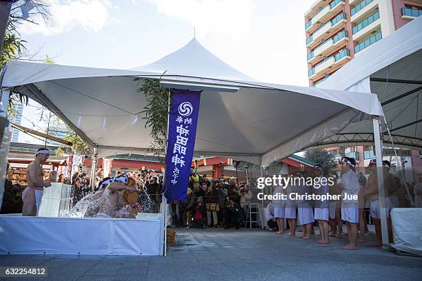 Participants take part in the ice water winter purification ceremony on January 21, 2017 in Tokyo, Japan. At Daikoku Matsuri festival, young people...